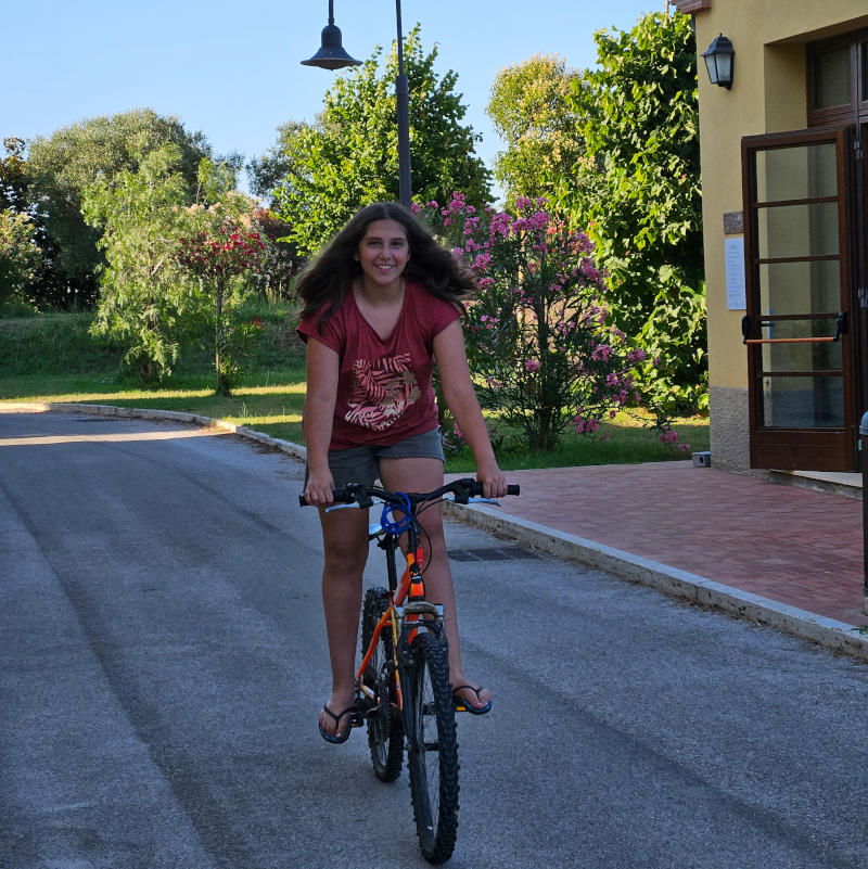 Sophie cycling inside Poggio all’Agnello